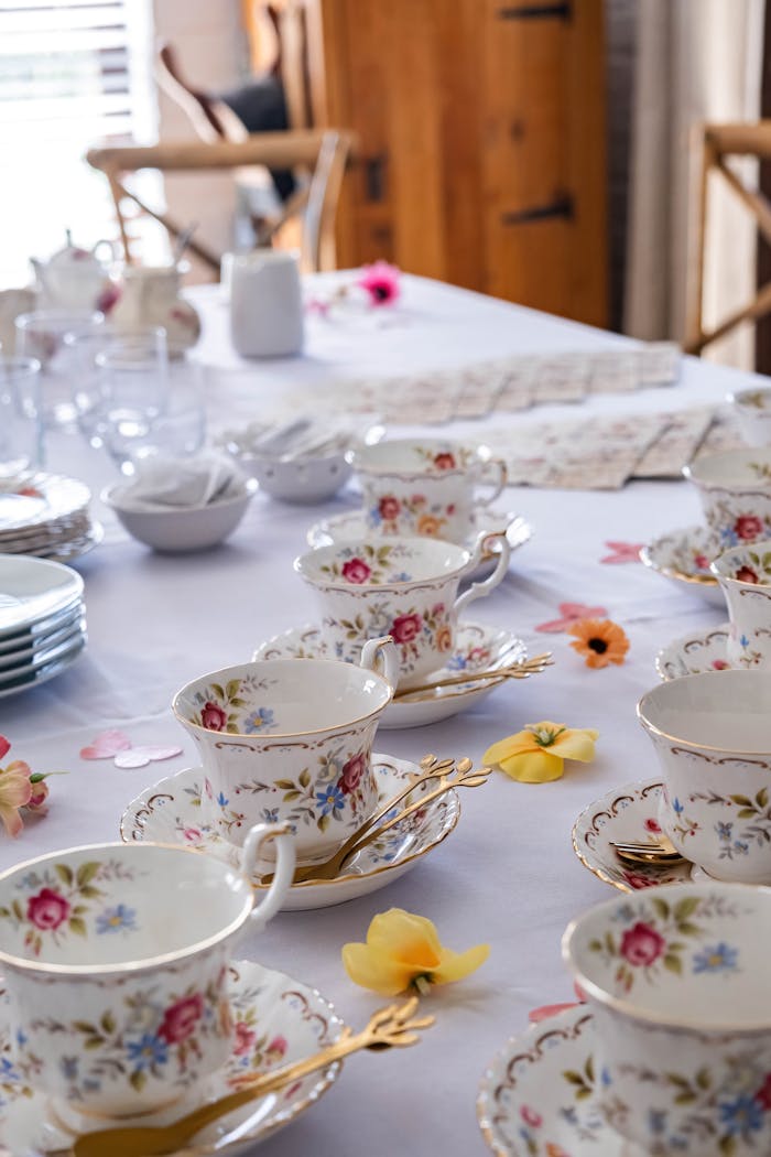 Mastering the First Impression: Your intriguing post title goes here Beautifully set table for afternoon tea with floral china, perfect for gatherings.