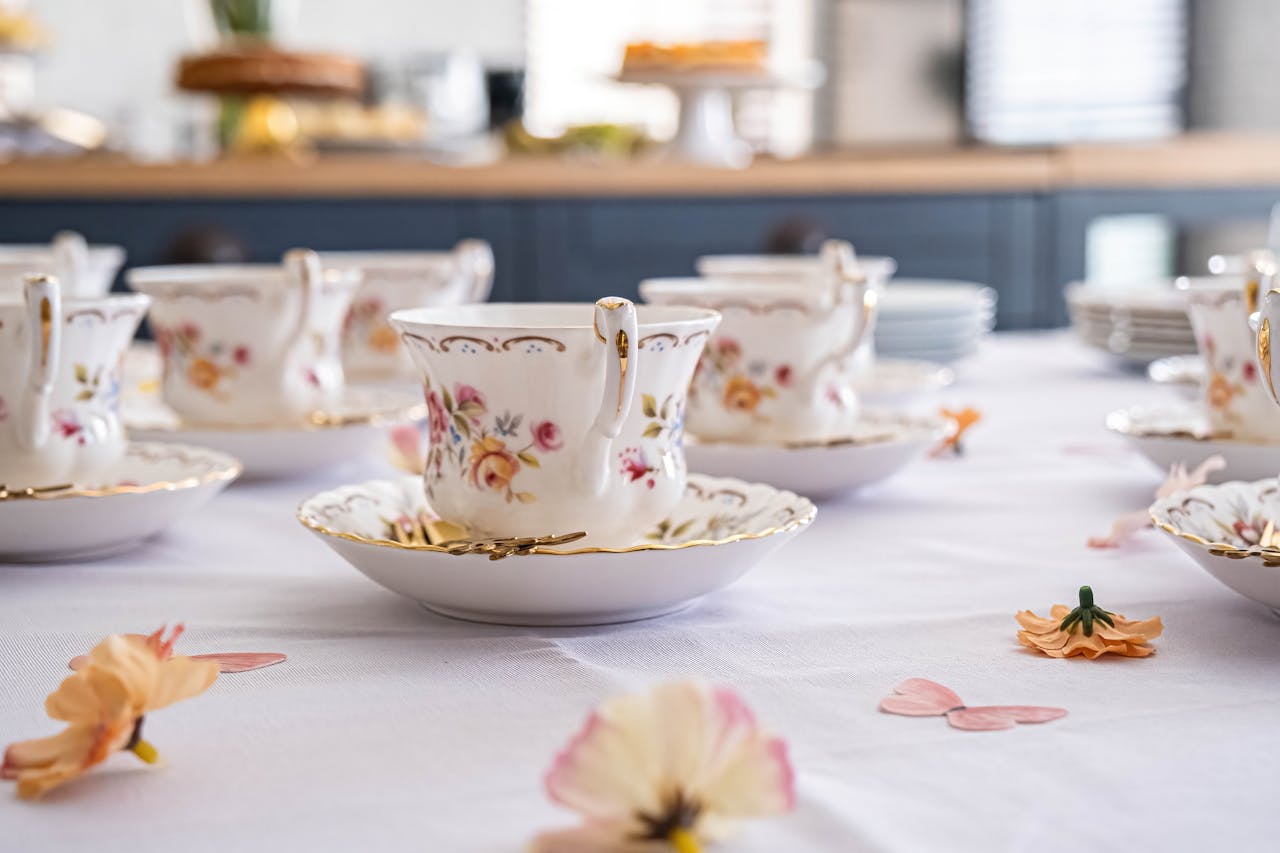 The Art of Drawing Readers In: Your attractive post title goes here Delicate floral china cups elegantly set up for a tea party. Perfect for showcasing vintage charm.